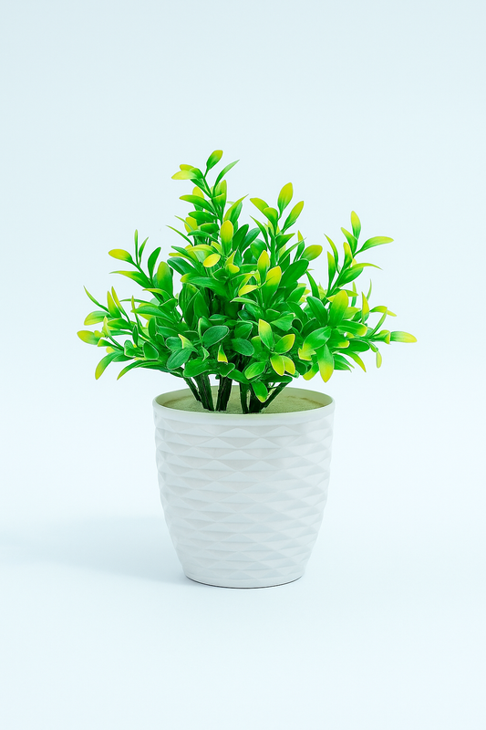 Artificial Green Foliage in Embossed White Ceramic Pot