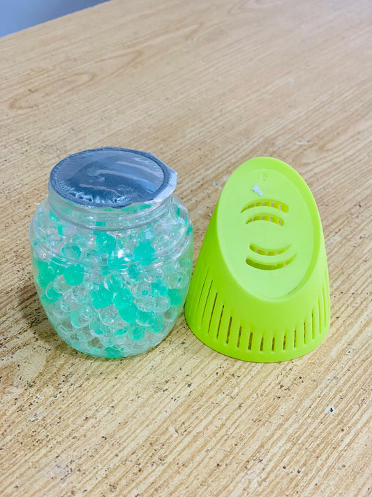 Air freshner in glass container isolated on white background